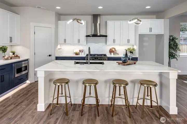 Large island in kitchen with built in breakfast bar
