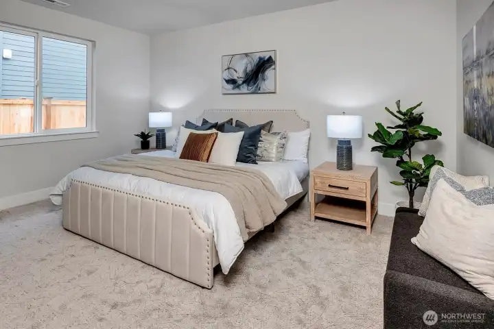 En suite bedroom on main level for guests or generational living