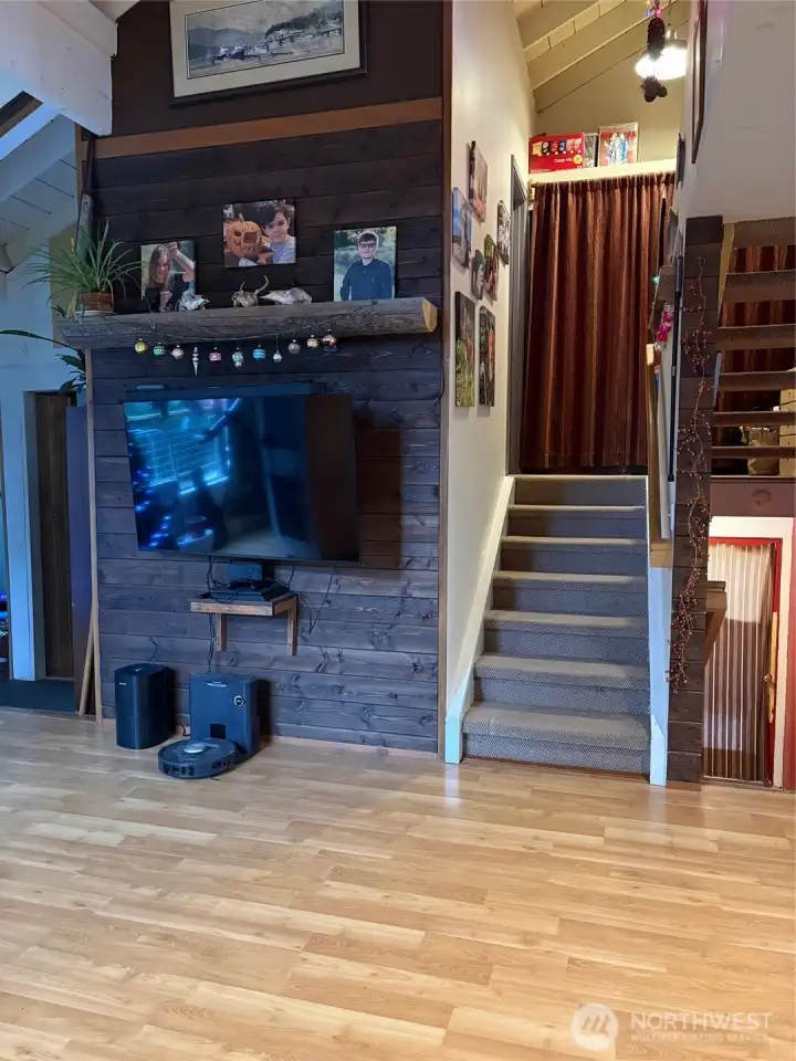 Accent wall and stairs up and down.