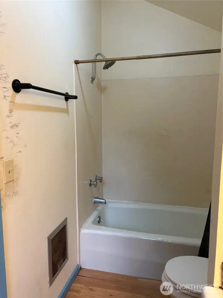 Upstairs Bathroom bathtub.