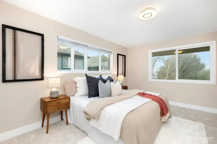 Spacious primary suite featuring an ensuite bath.