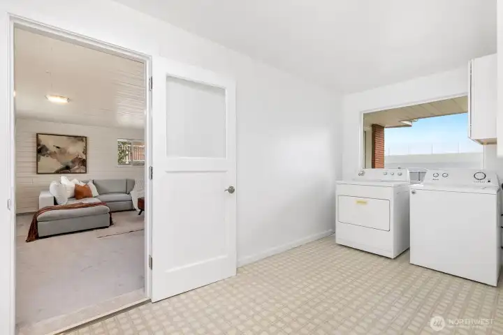 HUGE upper unit laundry room with storage area.