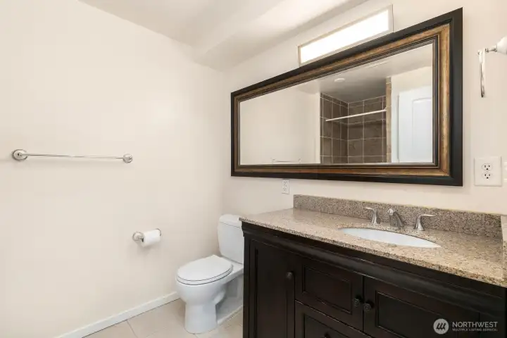 Ensuite .75 bath for the lower unit primary bedroom.