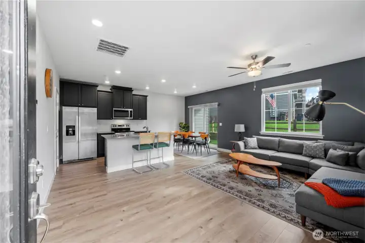 Seamless flow from kitchen to dining and living spaces.