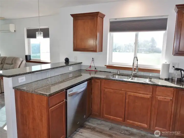 Kitchen w/ lots of counter and cabinet space.