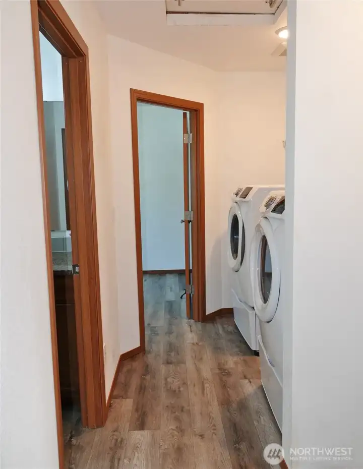 Hallway with the washer and dryer, which stay too!