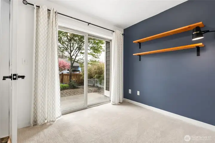 The den sliders open on to the front courtyard.