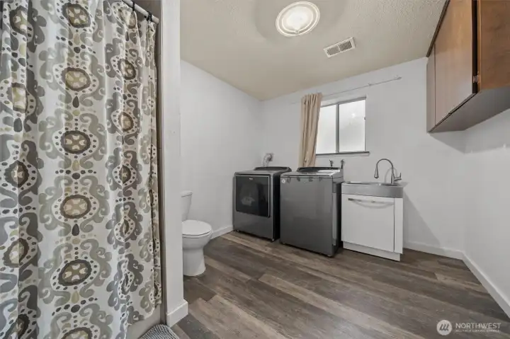 3/4 Bathroom, laundry room with utility sink downstairs.