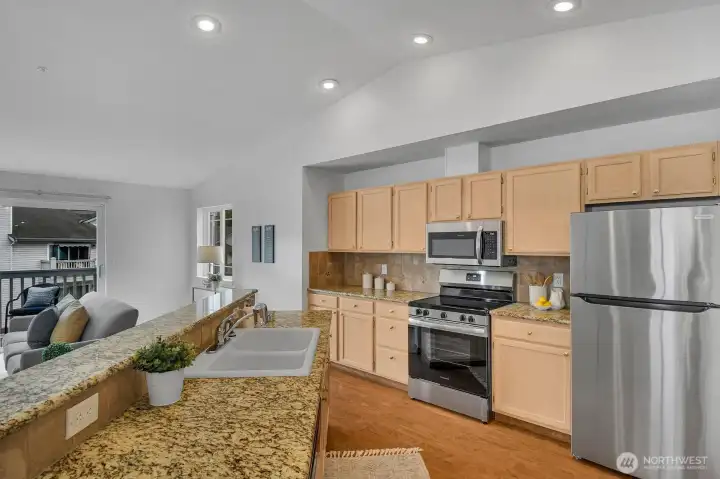 Brand new stainless steel appliances, cathedral ceilings, kitchen/living room/dining room create a great room effect, balcony off the living room, wood burning fireplace ~ Brand new stainless steel appliances, cathedral ceilings, kitchen/living room/dining room create a great room effect, balcony off the living room, wood burning fireplace ~