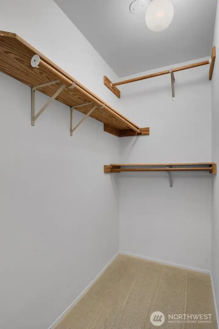 Walk in closet off primary bedroom Walk in closet off primary bedroom