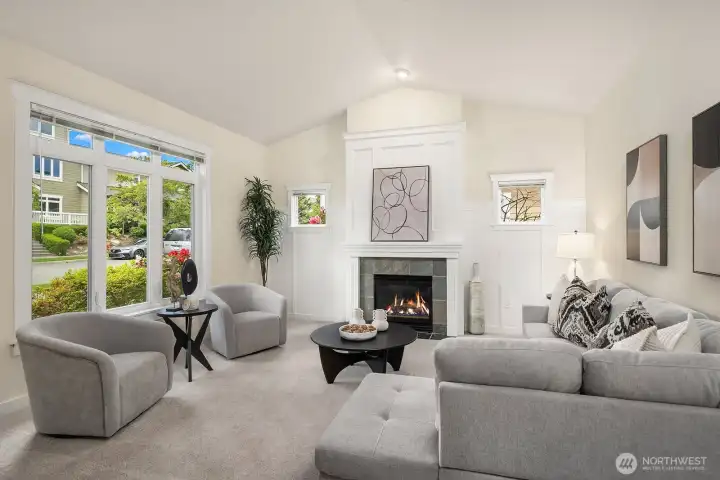 Vaulted ceilings and large windows wash this room in light