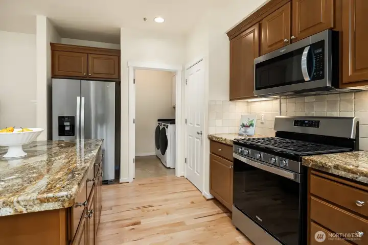 A large utility room with new washer and dryer  conveniently placed on the main floor