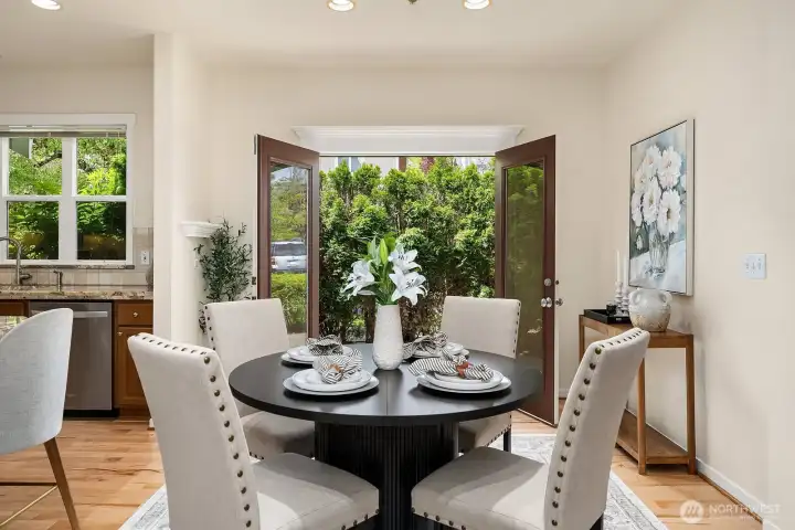 Beautiful French doors open to a private, lush patio