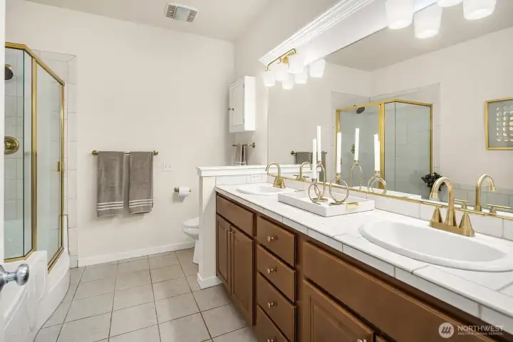 Large primary bathroom with upgraded fixtures and hardware