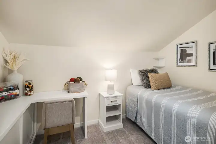 Bonus room alert! This flex room would make a perfect hobby room, office, play room and extra bedroom with built in cabinetry, desk and bedplatform