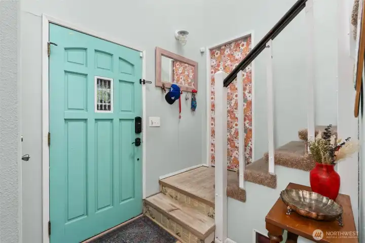 As you enter- stairs to the left take you to den and upstairs