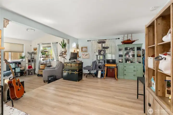 Dining space of the family room with wood burning fireplace