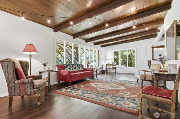 Beautiful beamed and wood lined ceilings create a warm and inviting feel to the spacious gathering room.
