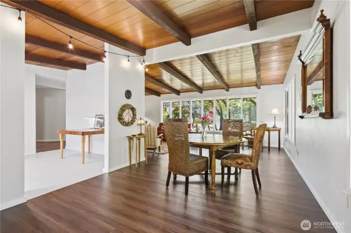 Vaulted ceilings and large windows give this dining area a wonderful backdrop for entertaining.