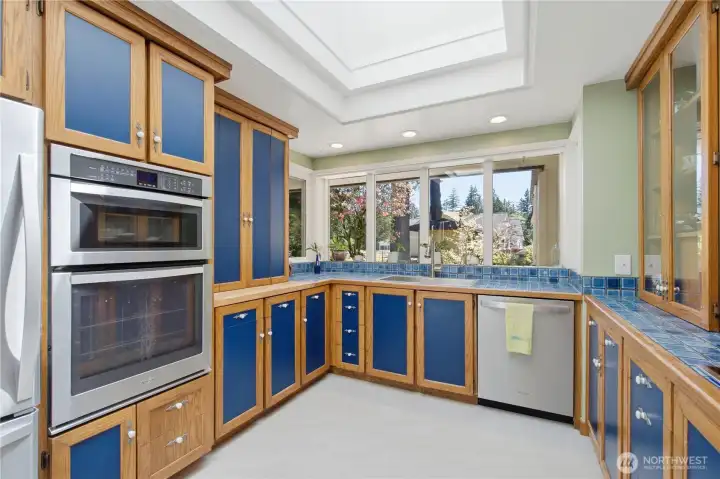 Abundance of windows and skylight brings in the sunshine and lets you view the peaceful gardens beyond.