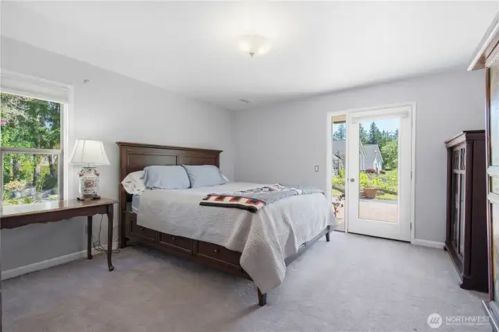 Second bedroom on the main level of the main home with entrance to the gardens.