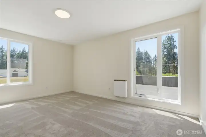 One of four rooms on the upper level of the main home.  Two of these rooms have rooftop deck assess.
