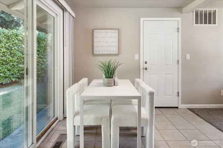 Dining area, washer/dryer just behind the door to the garage.