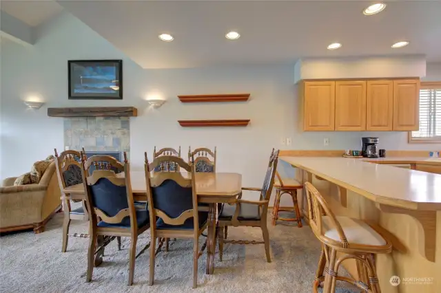 The open concept floor plan flows into the dining space, and the kitchen that also has eating space at the bar.
