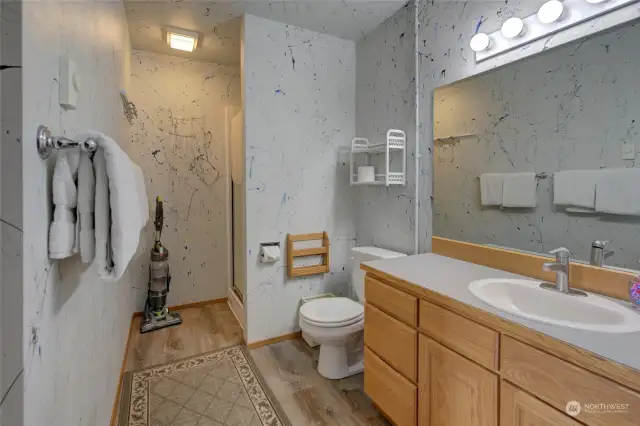The first floor also has a three-quarter bath, and laundry is also located in this room.