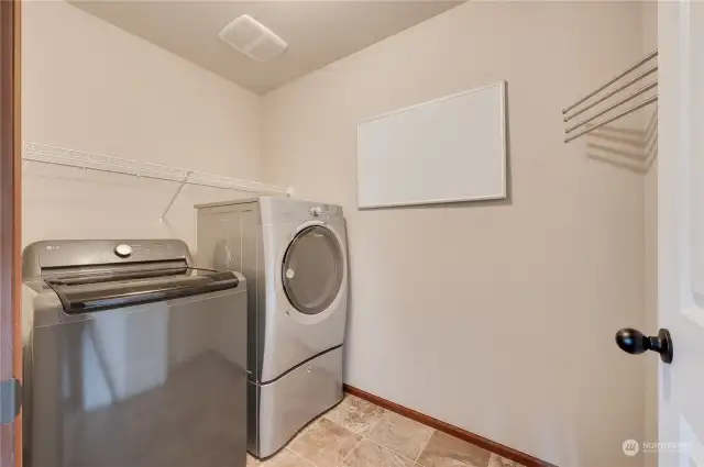 Large utility room conveniently located on the upper floor. Dryer and new washer included.