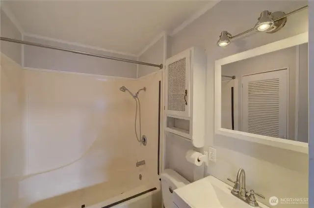 Next is main bath between first bedroom and kitchen