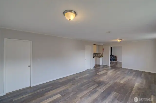 Another view from front door with first bedroom to left, great room ahead