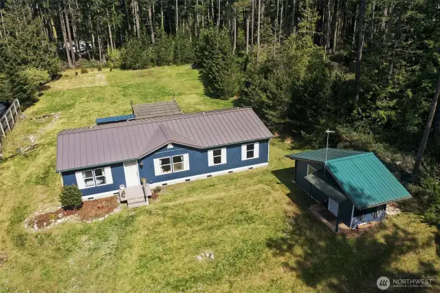Home, pump house/workshop and Sunny Backyard