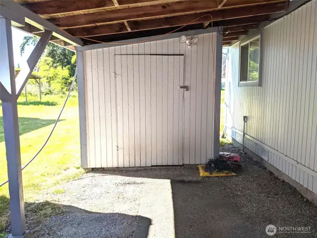 Storage buildings under carports