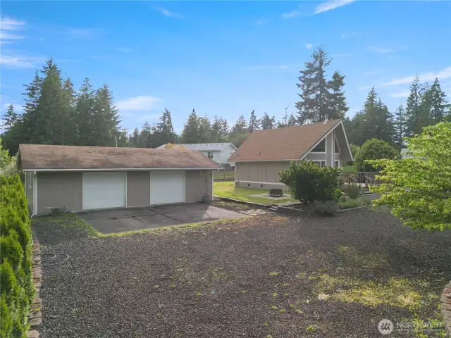 View from the left of the home - 2 car garage with shop and potential ADU?