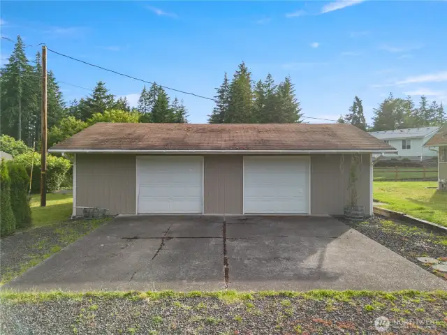 Garage view, paved driveway.