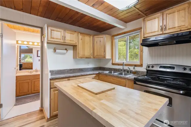 Kitchen view with bathroom door to the left