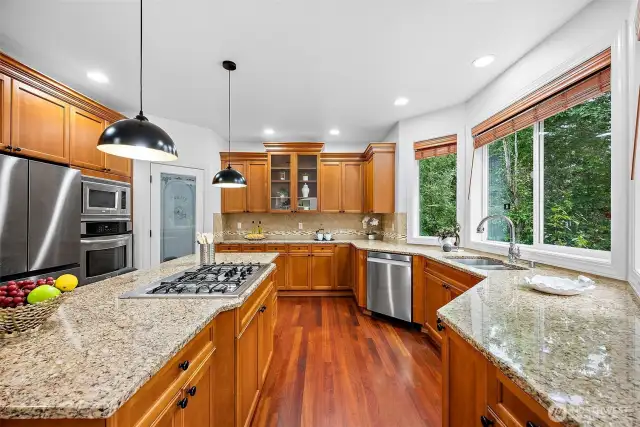 Some of the other kitchen features are a walk in pantry, ample cabinet and storage space, 5 burner gas stove, tile backsplash and undermount sink.