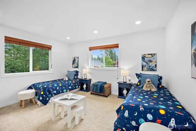 Bedroom 3 on the upper level features an en-suite/Jack & Jill bathroom.