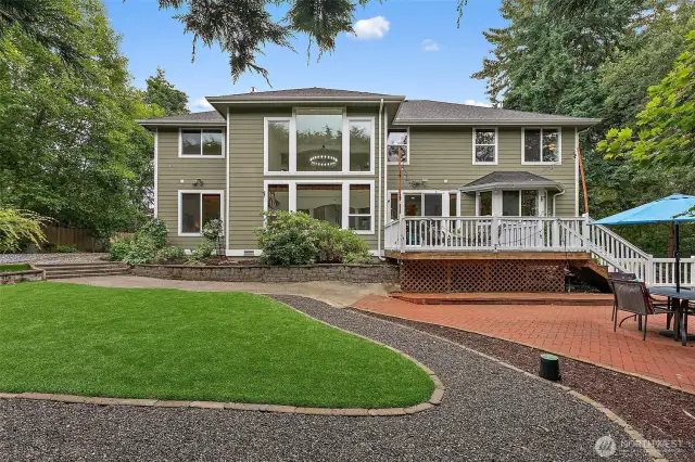 The property has walkways and pavers in the back to assist with easy upkeep. Lots of mature landscaping throughout.