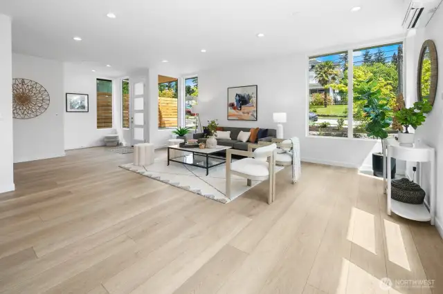 Entry sightline across the great room shows just how airy and inviting the layout really is. Photos are of model home 8825, finishes and floorplan may vary.