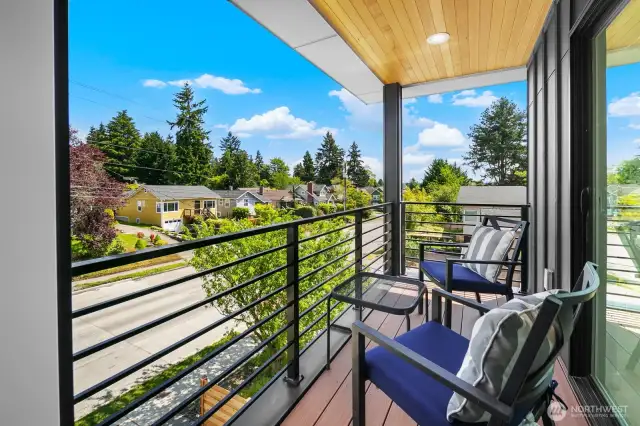 Covered view deck off the bedroom invites coffee at sunrise and stargazing at night. Photos are of model home 8825, finishes and floorplan may vary.