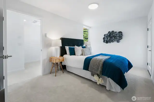 Alternate angle reveals generous wall space for art and a calm, neutral palette. Photos are of model home 8825, finishes and floorplan may vary.