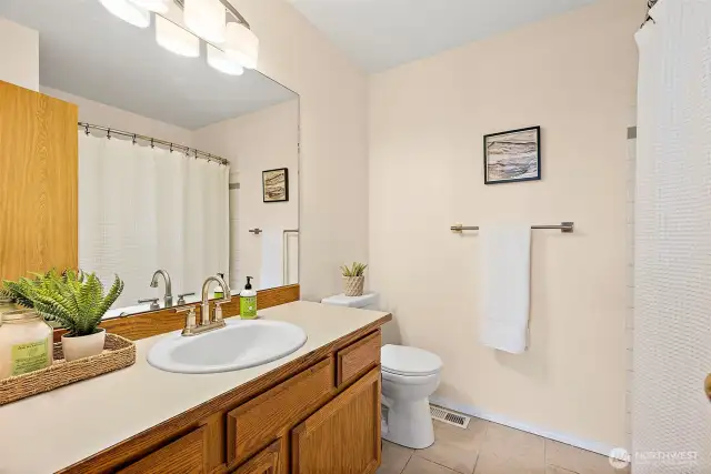 Upstairs main bathroom is a good size, fresh paint, ready for your people!