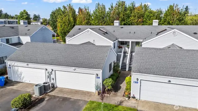 Lovely attached condo unit with no neighbors above. Two car garage plus driveway parking