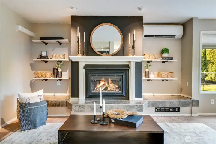 Just add ambiance with this show stopping fireplace central in this space.
