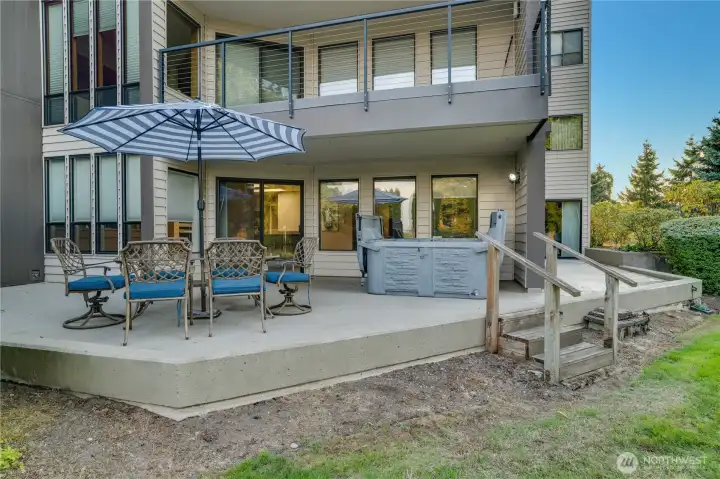 Extended patio from the main living area and the primary suite give access to the hot tub.