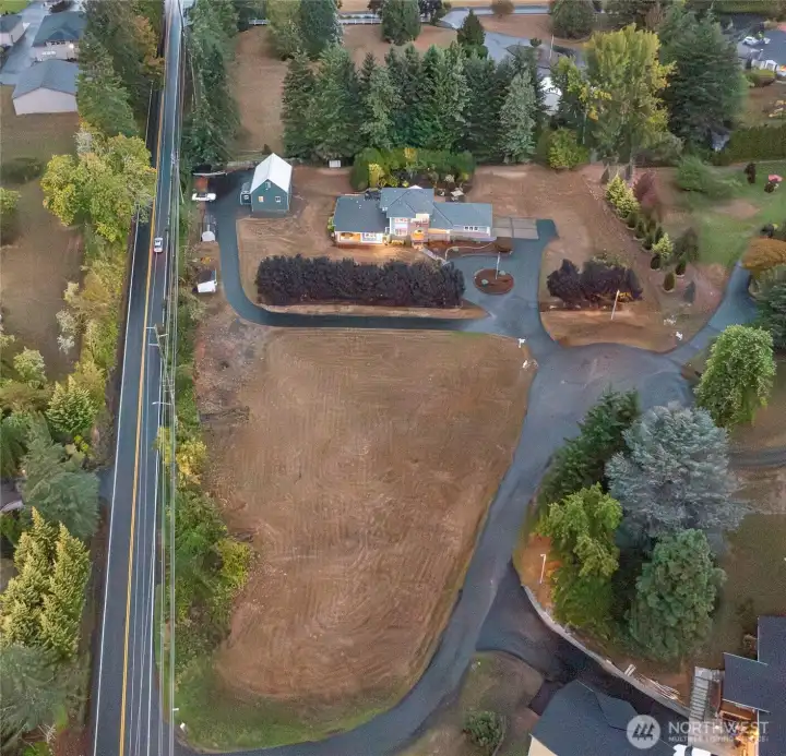 Arial view of entire acreage from Seward Rd to 146th Circle driveway and tree line is the east border and north border.