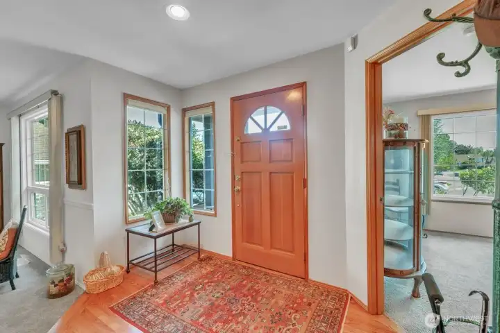Welcoming entry with main floor bedroom/office to the right and spacious living rom to the left.