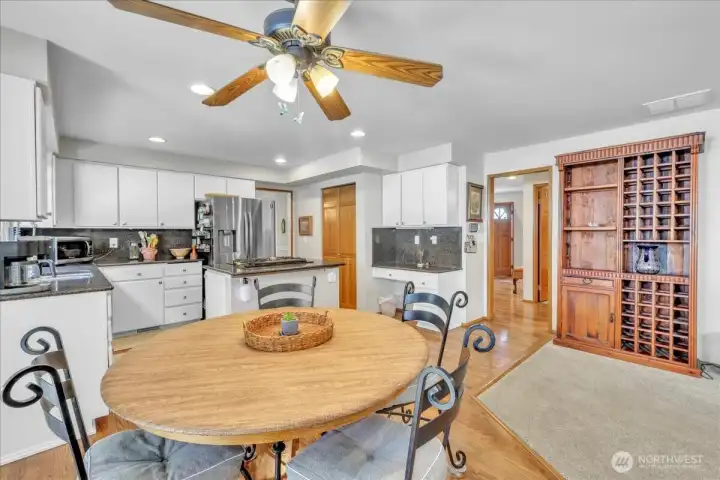 Bright filled breakfast nook, looking at the kitchen, toward the entrance or to the left is your dinning area.